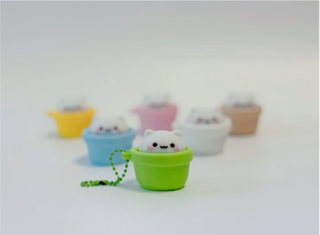 Green cat pot clicker in focus