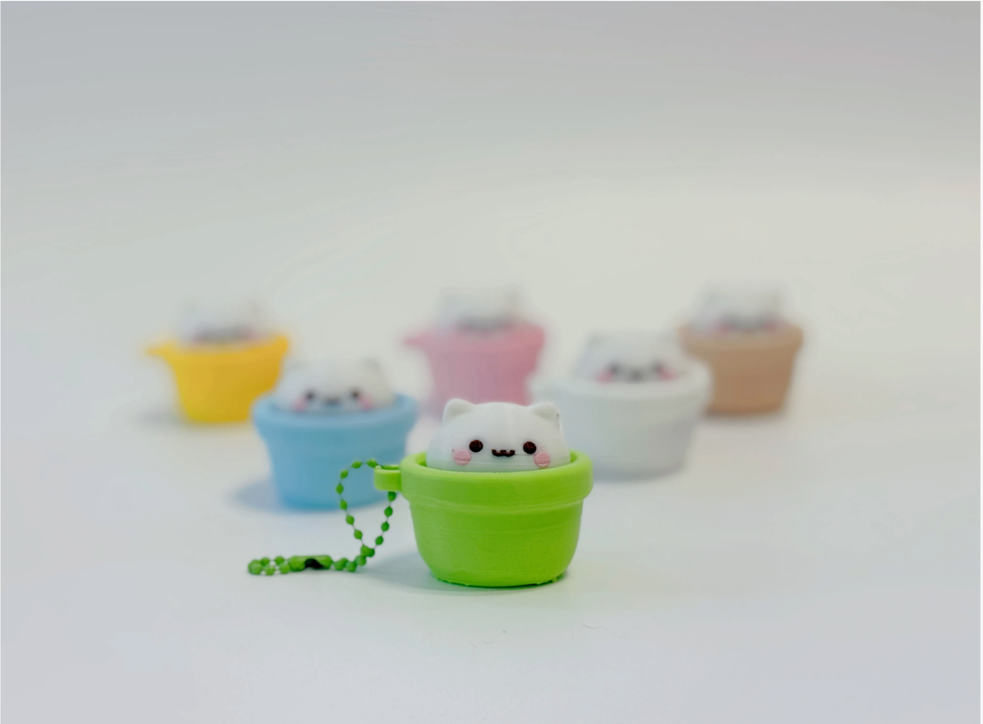 Green cat pot clicker in focus